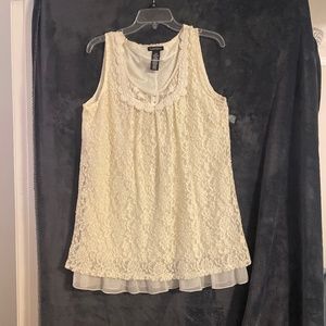 Sleeveless tunic style top with lace overlay